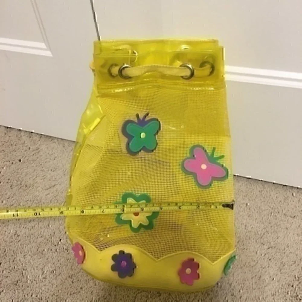 Girl’s yellow beach bag